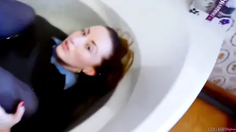 For water and stocking fetishists: she gets in the bathtub wearing her college uniform