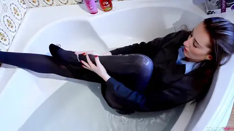 For water and stocking fetishists: she gets in the bathtub wearing her college uniform
